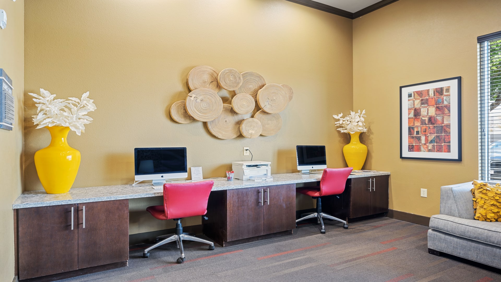 a clean and organized office with a desk and chairs at The Anatole at City View